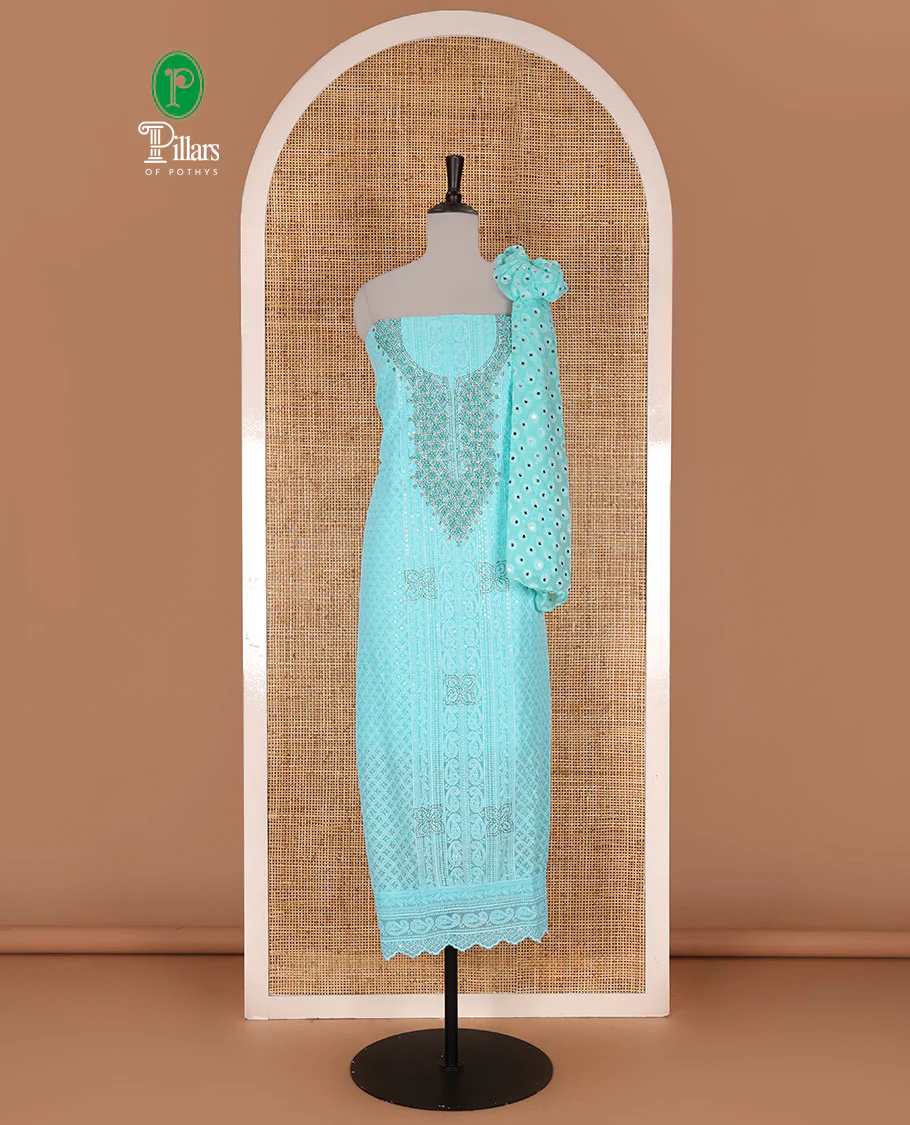 Aqua green material churidar set, stone work with Schiffli style embroidered georgette top, American Crape bottom, and polka dotted printed mirror work dupatta