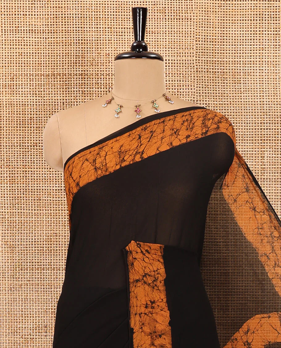 Black and mustard plain georgette saree, batik printed border, batik printed checked pallu, and a matching blouse - Image 2