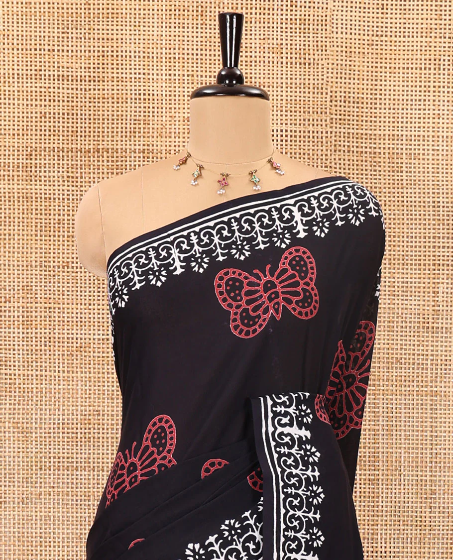 Black half-and-half style butterflies and warli theme  block printed soft mul cotton saree, printed border, floral printed pallu, and a plain blouse - Image 3