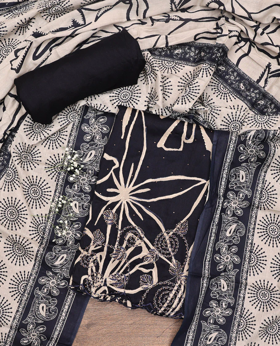 Black Material Chudidar Set, Artfully Detailed with Abstract Print and Floral Embroidered Cotton Top, a Plain Cotton Bottom, and Paired with Intricately Printed Cotton Dupatta