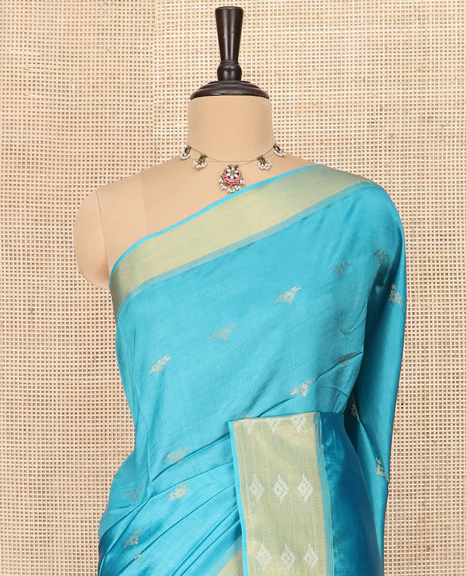 Blue Banana Pith Saree Elegantly Framed with Zari Buttas, Artfully Detailed Border with Zari Designs, Gleaming Zari Stripes Woven Pallu, and Paired with a Matching Plain Blouse - Image 2