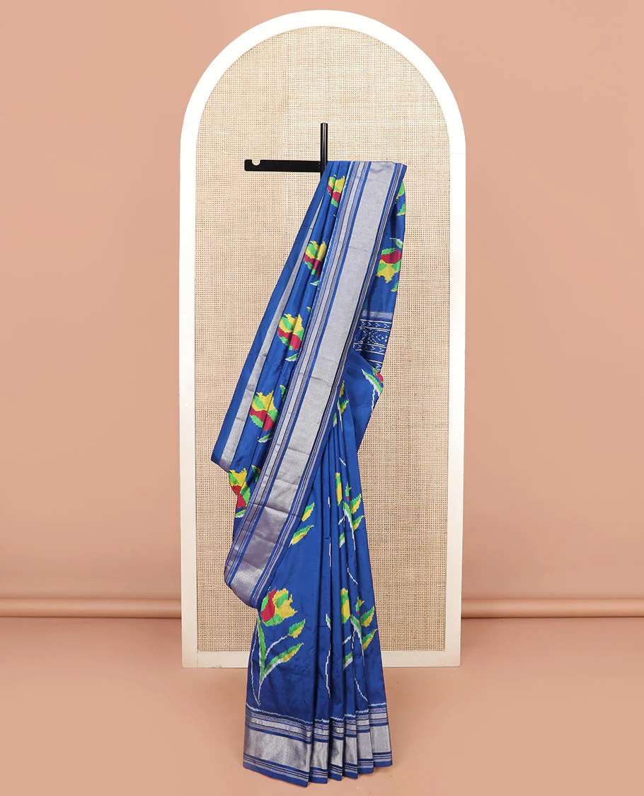 Blue Ikkat Silk Saree Colourfully Woven in Floral Buttas Across the Body, Featuring a Zari Border, a Pallu Adorned with Ikkat Weave, and Paired with a Matching Blouse - Image 2