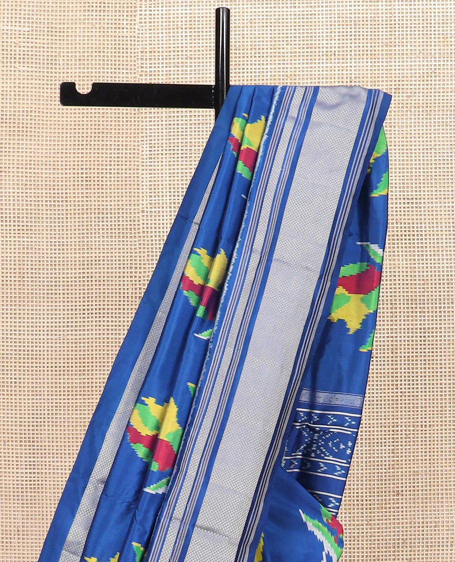 Blue Ikkat Silk Saree Colourfully Woven in Floral Buttas Across the Body, Featuring a Zari Border, a Pallu Adorned with Ikkat Weave, and Paired with a Matching Blouse - Image 3