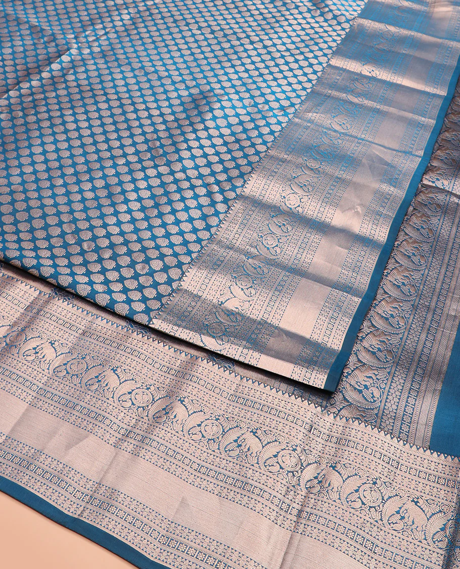 Blue Kanchipuram Wedding Silk Saree Gracefully Embellished with Zari Buttas, Highlighted with Zari Border of Thilakam, Star Vanki, Yaanai, and Round Mayil Designs, Majestically Zari-Woven Pallu, and Paired with a Matching Blouse - Image 3