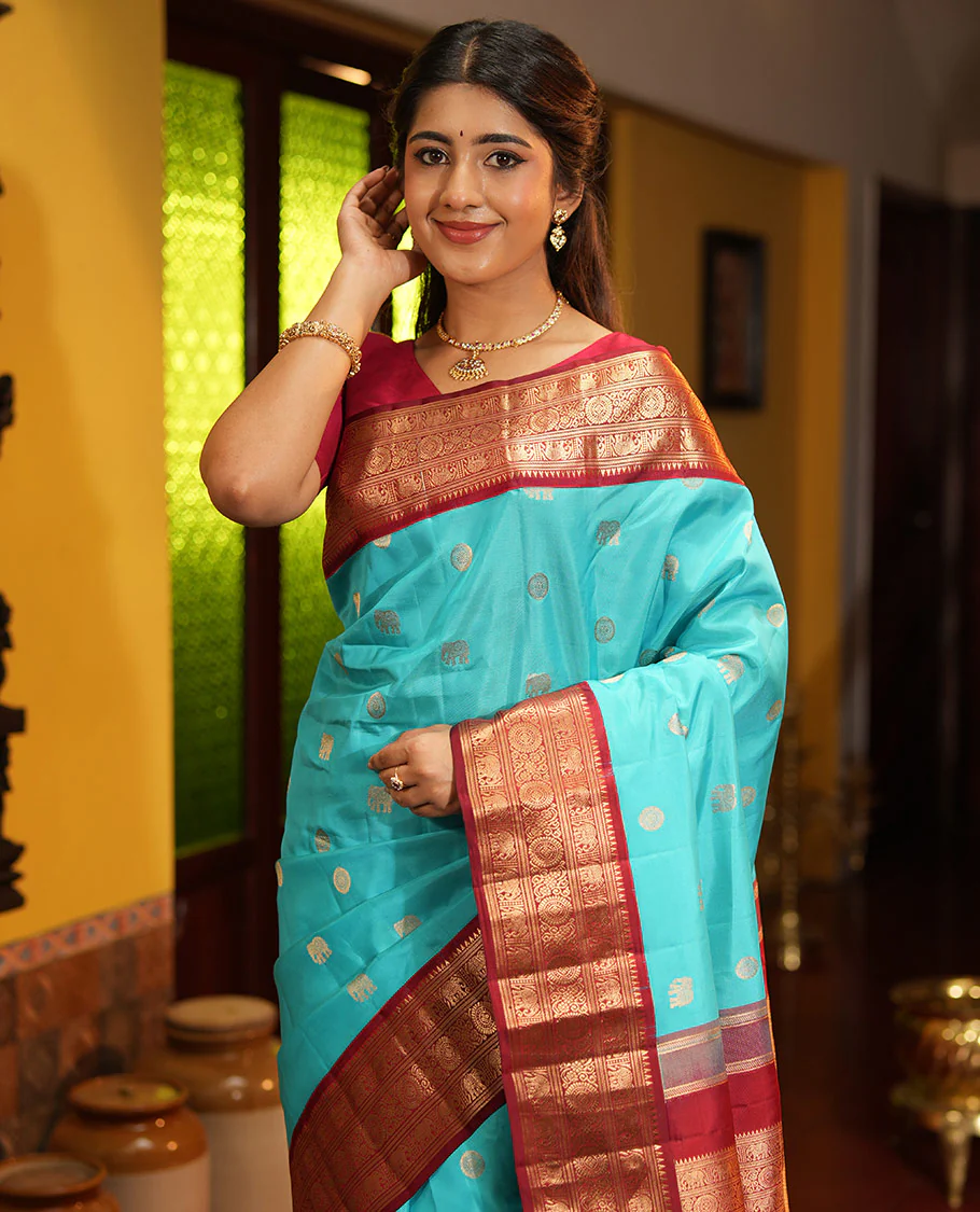 Blue Vasundhara Silk Saree, Embellished with Mayil and Yaanai Buttas Across Its Body, Complemented by a Contrast Korvai Border of Rekku, Banaras, Yaanai, and Chakram Designs, Gleaming Jaal Pallu, and Paired with a Contrast Blouse - Image 3
