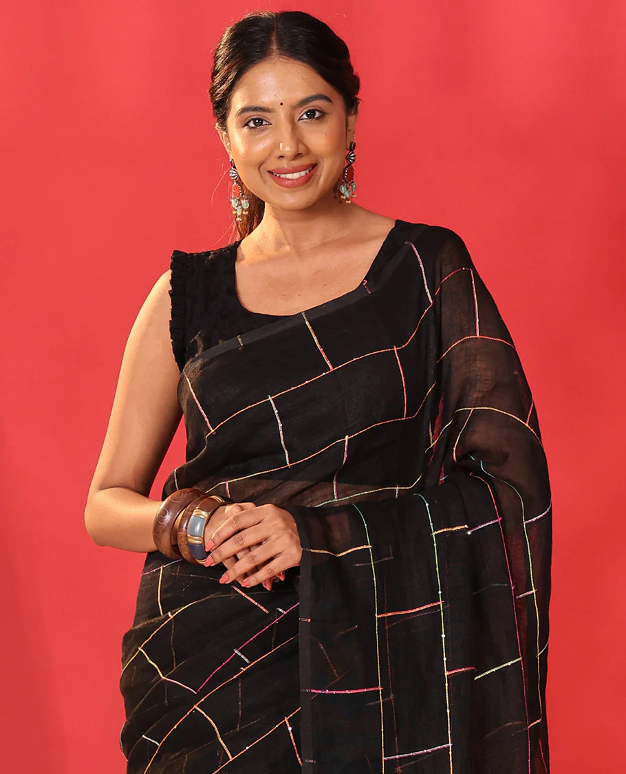 Borderless black checked linen cotton saree, contrast pallu of colorful floral motifs - Image 2