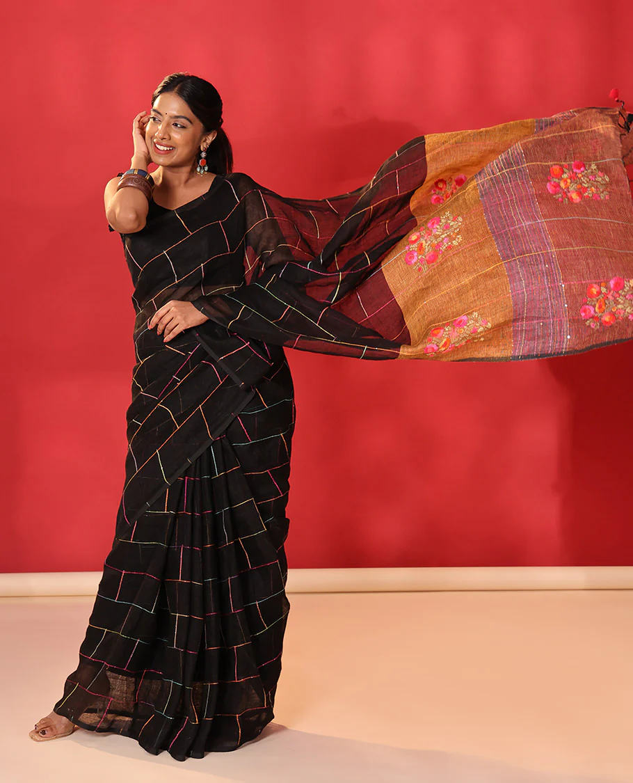 Borderless black checked linen cotton saree, contrast pallu of colorful floral motifs - Image 5