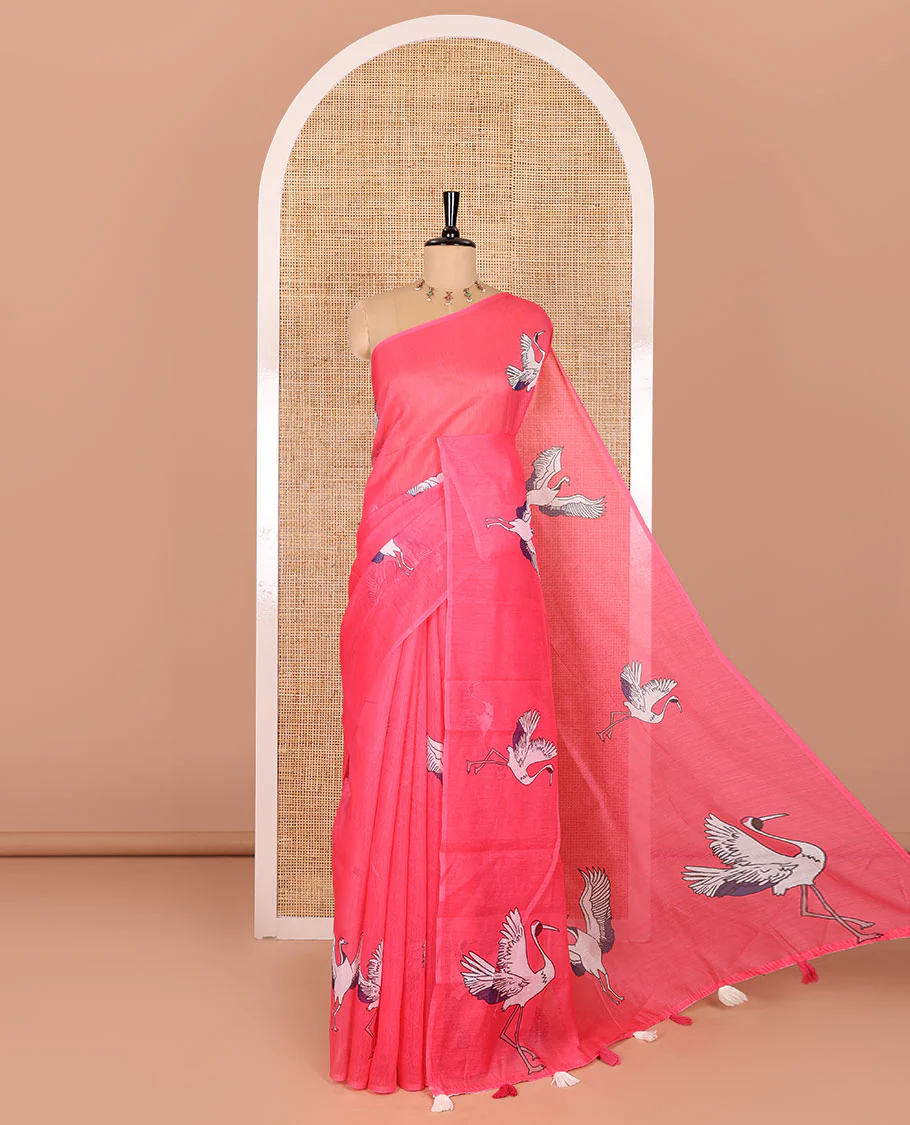 Borderless pink crane motifs printed linen cotton saree, crane motifs printed pallu, and a contrast crane printed blouse
