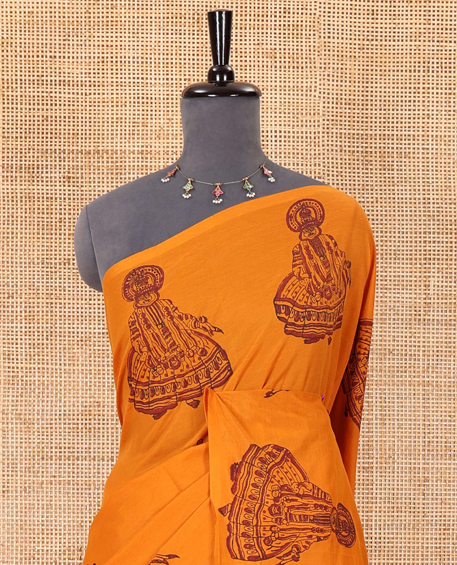 Borderless yellow kolam and kathakali motifs printed South cotton saree with a matching blouse, and a contrast floral vine printed blouse - Image 3