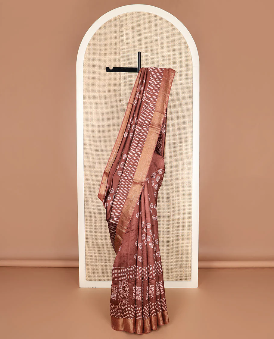 Brown floral and geometric printed banana pith saree, zari border, and printed pallu