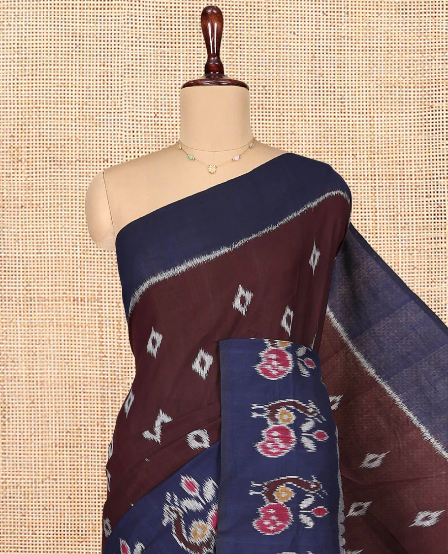 Brown Ikkat Cotton Saree, Decked Up with Ikkat Buttas All Over Its Body, Complemented by a Contrast Ikkat-Style Border of Peacock Buttas, Chevron Striped Pallu, and Paired with a Contrast Blouse - Image 2