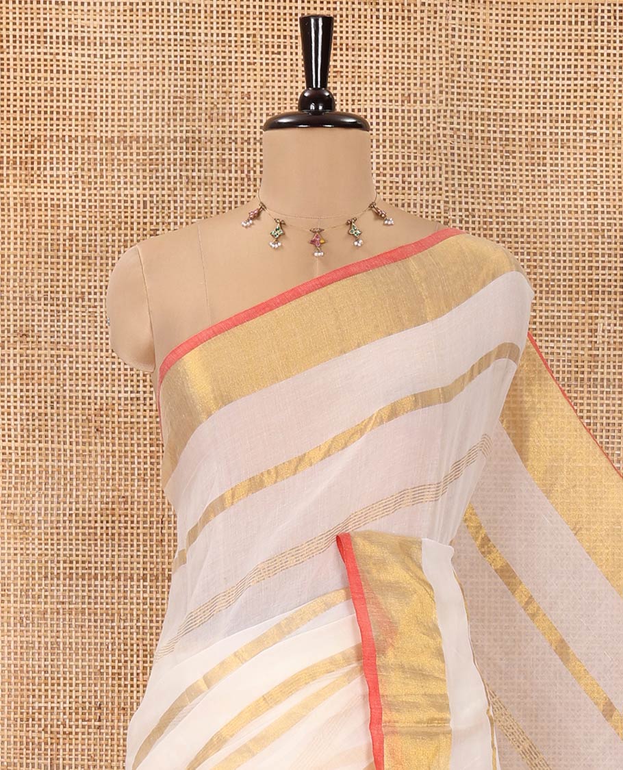 Cream Khadi Mul Cotton Saree, Gleamed up with Zari Stripes All Over Its Body, Subtle Gold Zari Border, Self-Pallu with Tassels, and Paired with a Matching Blouse - Image 2