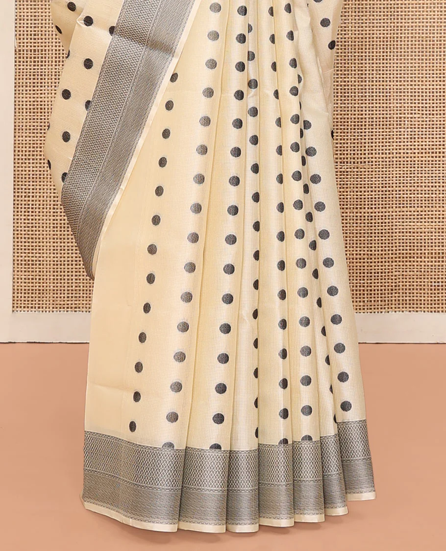 Cream Mayuri Soft Silk Saree, Accentuated with Polka Dot Buttas All Over Its Body, Sparsely Woven Geometric Patterned Border, Pallu Steeped with Floral Designs, and Paired with a Matching Blouse - Image 4