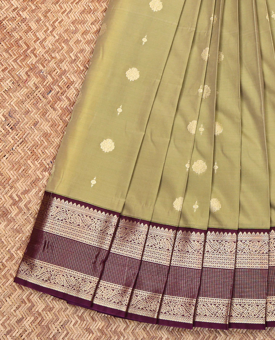 Green Budget Silk Saree, Adorned with Zari Buttas All Over Its Body, Complemented by Contrast Border of Traditional Zari Designs, Gleaming Zari Design Pallu, and Paired with a Contrast Blouse