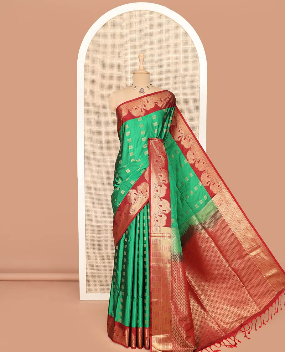 Green Semi-Soft Silk Saree Artfully Detailed with Square-Shaped Buttas Woven All Over Its Body, Complemented by a Contrast Elephant Motifs Zari Border, Pallu Highlighted with Chevron Designs, and Paired with a Contrast Blouse