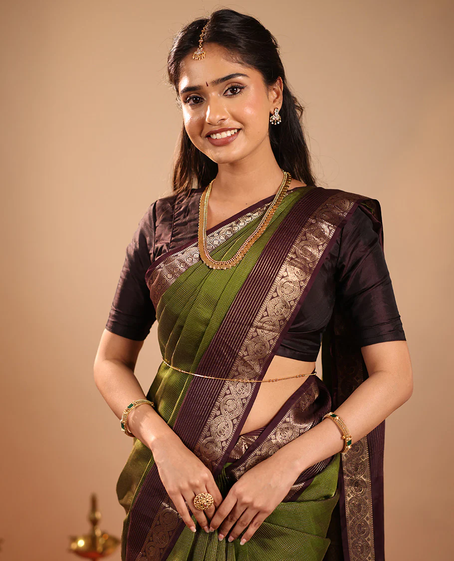 Green Vasundhara Silk Saree Mesmerized with Zari Micro-Checks All Over Its Body, Complemented by a   Contrast Border of Rekku, Kamalam, Mayil Kann, Yaanai and Mayil Designs, Subtly Sparkled Pallu of Jaal Designs, and Paired with a Contrast Blouse - Image 4