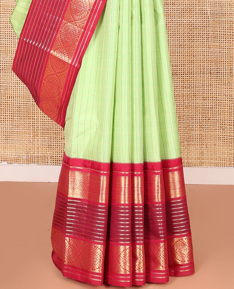 Green Vasundhara Silk Saree Subtly Sparkled with Stripes, Highlighted by a Contrast Border of Muthu, Diamond, Kamalam, and Laddu Kamalam Designs, Delicately Woven Pallu of Intricate Designs, and Paired with a Contrast Blouse - Image 4