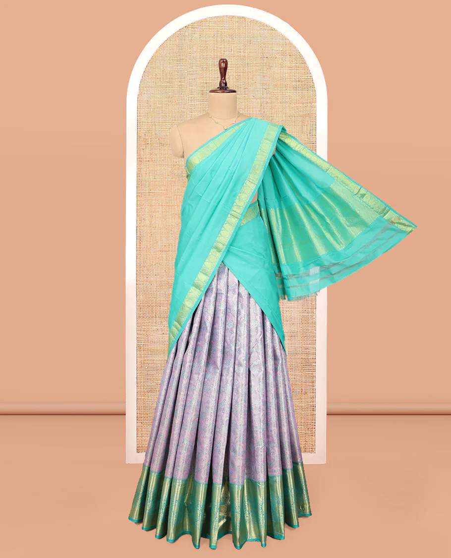 Grey Art Silk Material Half Saree Set, Adorned with Jacquard Design Skirt, a Contrast Traditional Zari Design Border, Contrast Zari-Jacquard Blouse, and a Dhavani of Paisley Designs