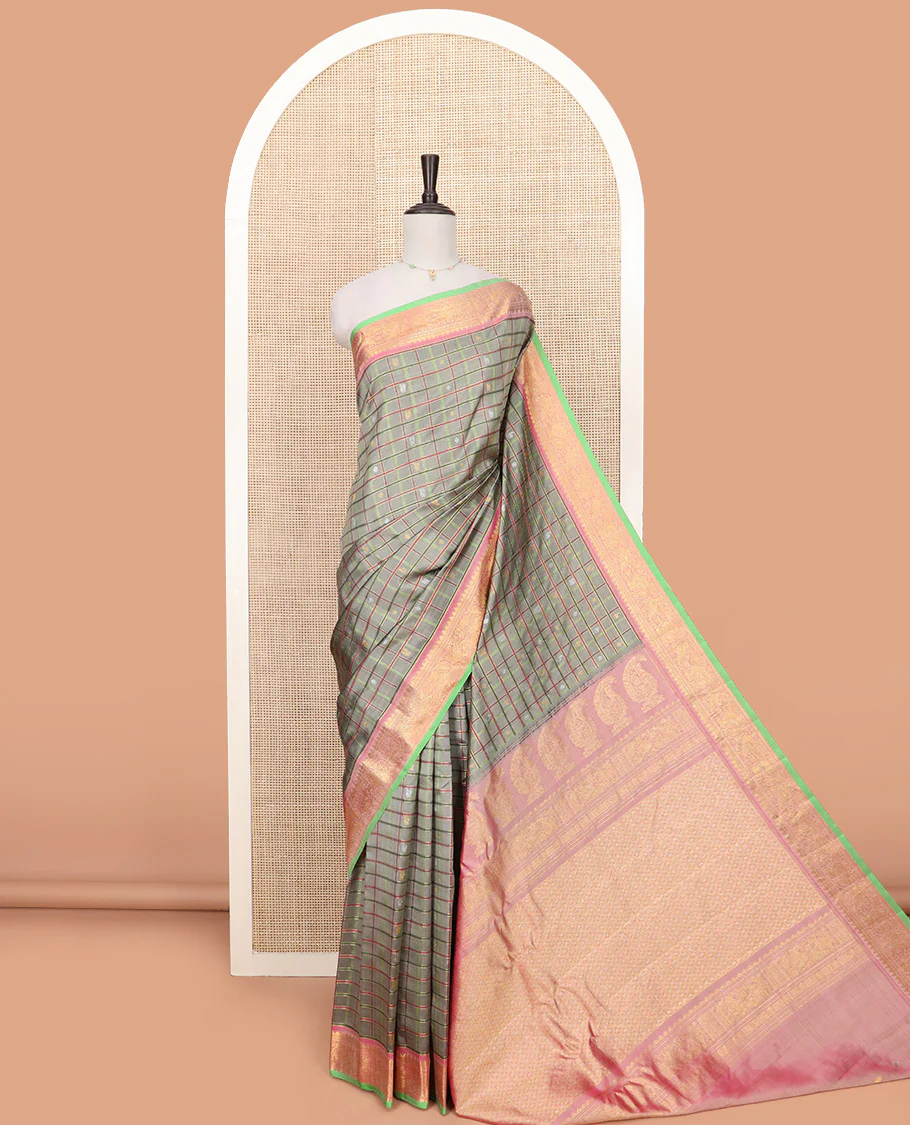 Grey Gadwal Saree Decorated with Buttas and Checks, a Contrasting Border Woven with Traditional Zari Designs, the Pallu Is Complemented by Jaal Design, and a Contrast Blouse