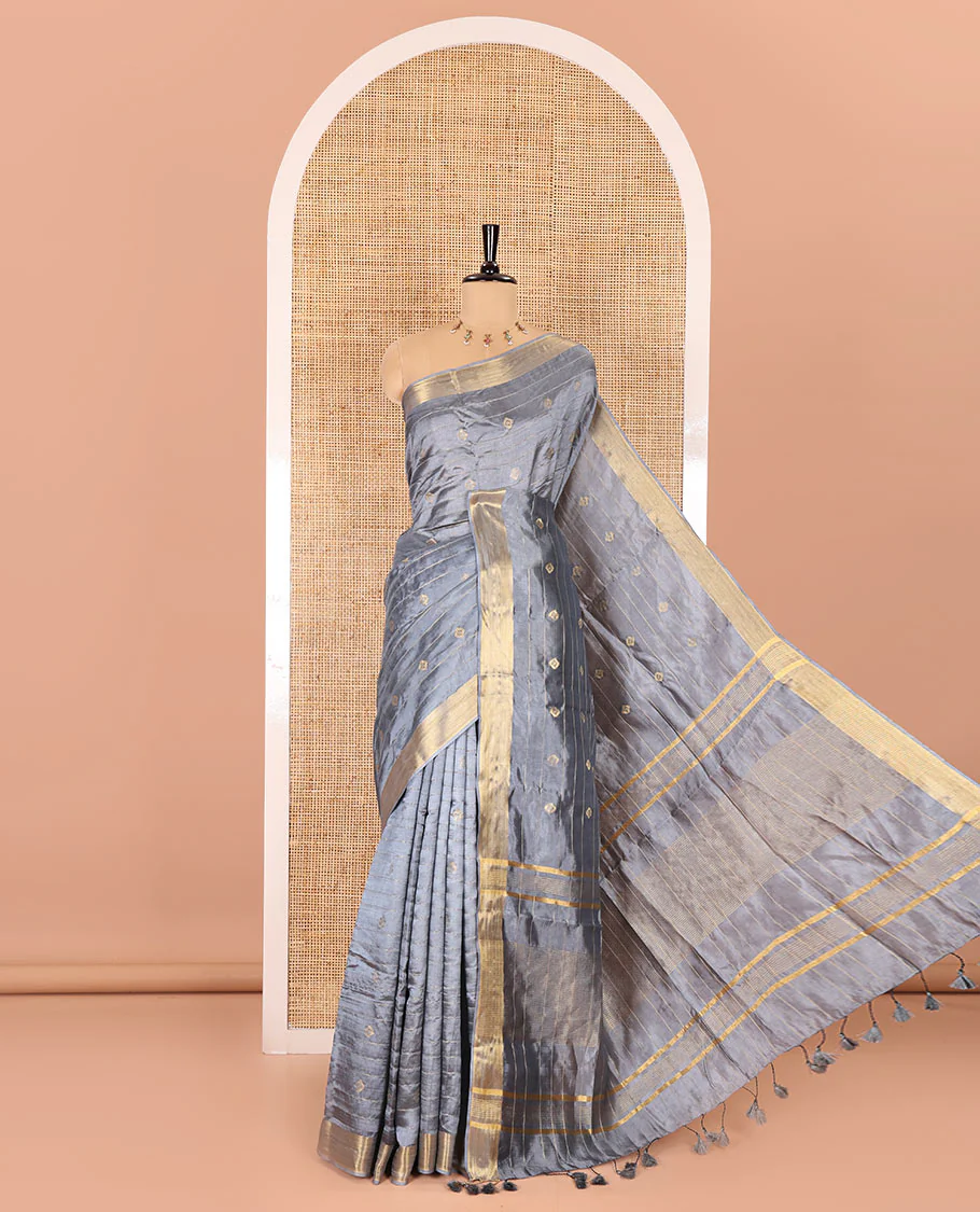 Grey zari buttas and striped banana pith saree, bavanji border, zari striped pallu, and a matching blouse