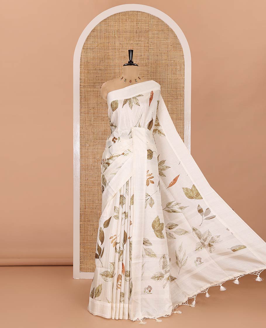 Half-white unique size and shaped leaf motifs printed fancy tussar saree, resham thread woven border, leaf motifs printed pallu, and a matching striped blouse