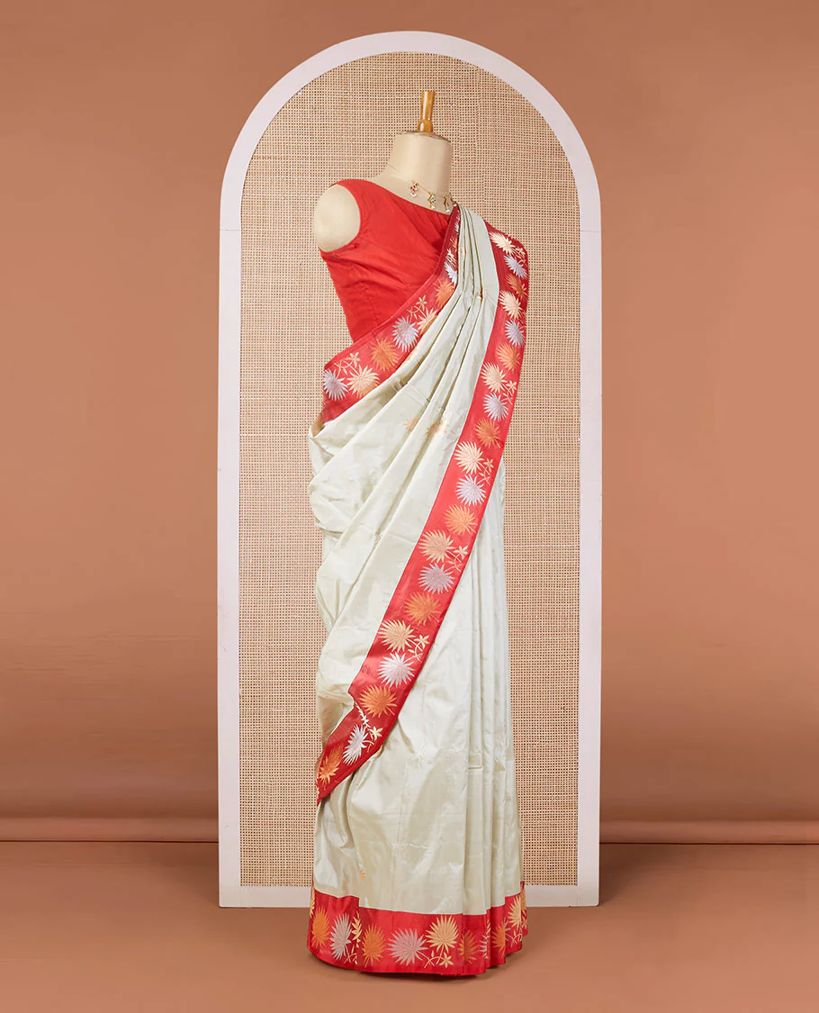 Half-white zari buttas katan silk saree, contrast floral design zari border & geometric patterned pallu