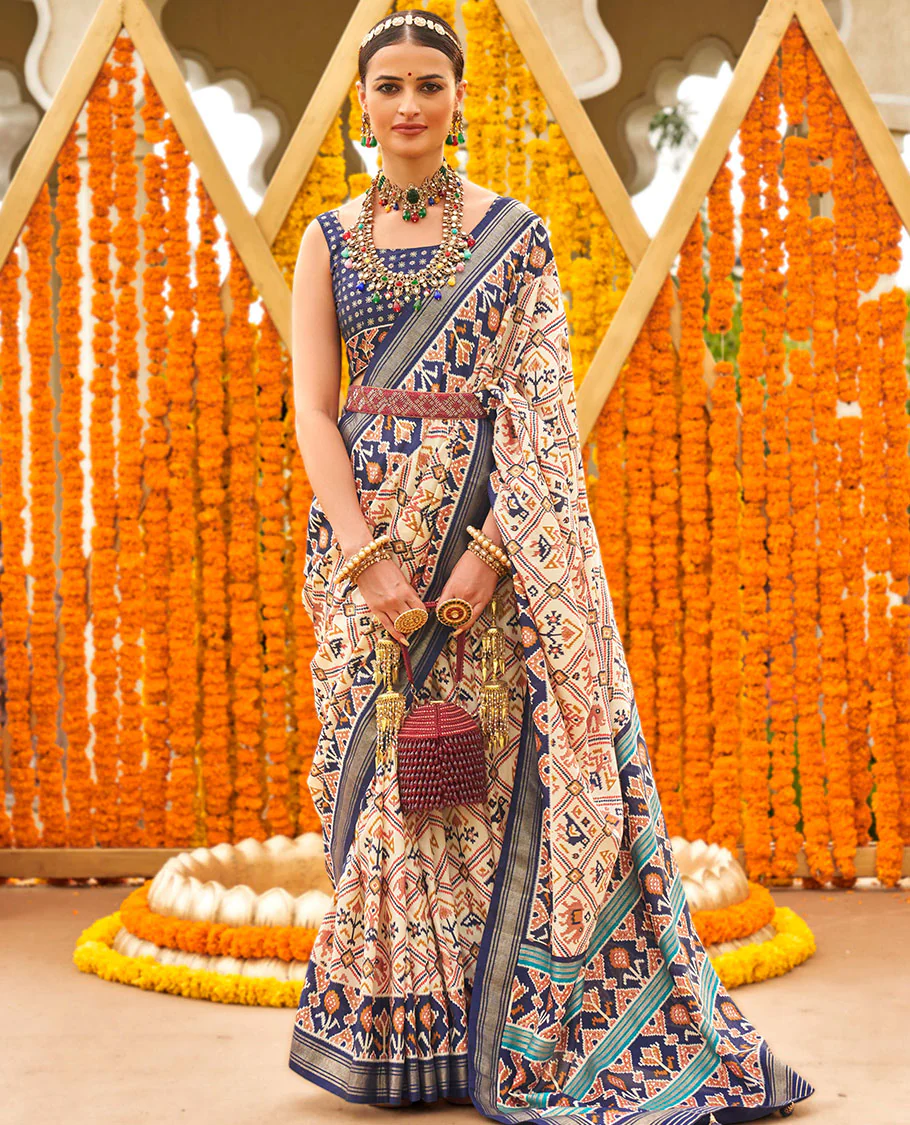 Light purple base butta enclosed jaal patola printed designer saree, contrast ikkat border, and floral ikkat design pallu