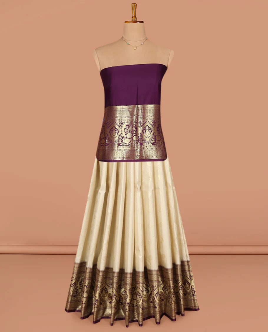 Light Sandal Art Silk Pavadai Material Set, Impeccably Styled with Buttas and Checks on Its Skirt, Complemented by a Contrast Mughal-Style Zari Design Woven Border, and Paired with a Contrast Blouse