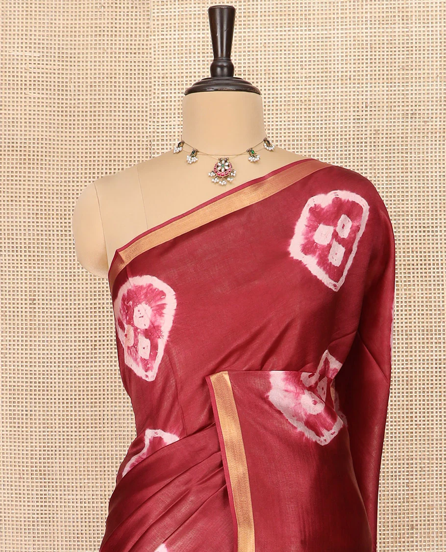 Maroon Banana Pith Saree Elevated with Bright Shibori Print, Subtly Woven Zari Bavanji Border, Pallu Featuring Shibori Print, and Paired with a Matching Shibori Printed Blouse - Image 2