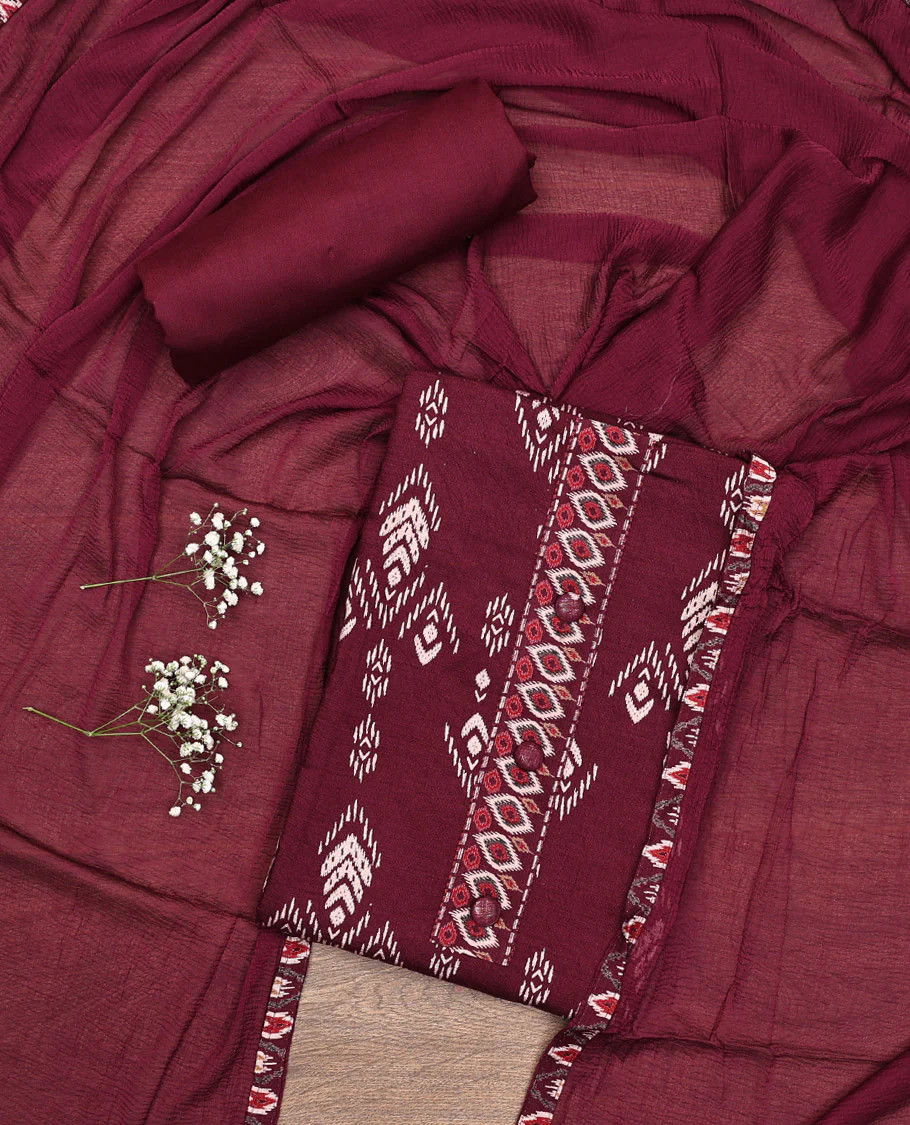 Maroon Material Chudidar Set, Bedecked with Ikkat-Style Motifs Print on Rayon Top, a Plain Cotton Bottom, and Paired with a Plain Chiffon Dupatta
