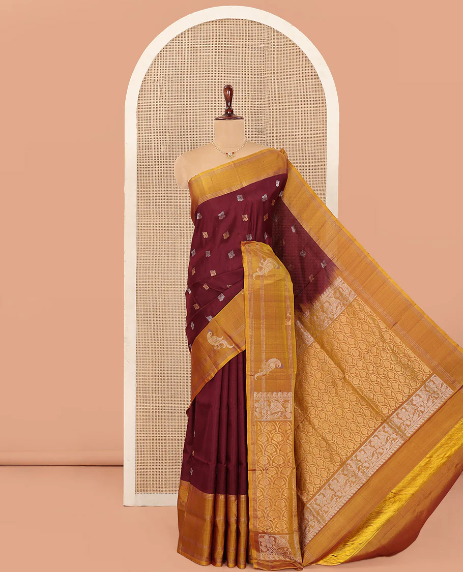 Maroon Uppada Silk Saree Ornamented with Zari Buttas, Complemented by a Contrast Zari Border of Bird Designs, Contrast Pallu of Scallop Designs, and Paired with a Contrast Blouse