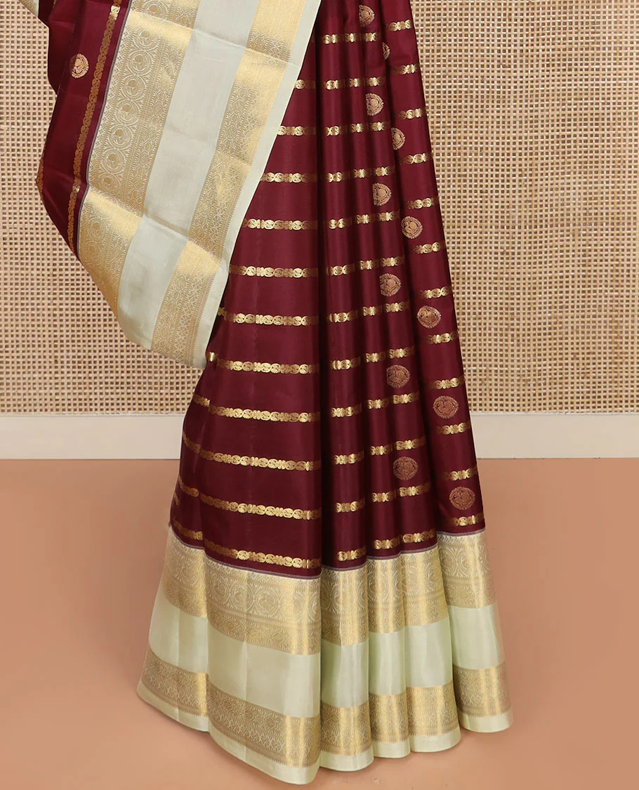 Maroon Vasundhara Silk Saree Richly Detailed with Zari Buttas and Zari Designs, Complemented by a Contrast Rettai Pettu Border of Round Mayil Designs, Subtly Designed Pallu of Floral Jaal Designs, and a Contrast Blouse - Image 4