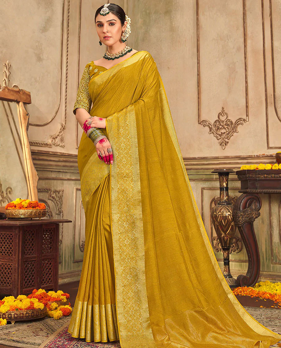 Mustard plain designer saree, patola-style motifs woven border, and zari striped pallu