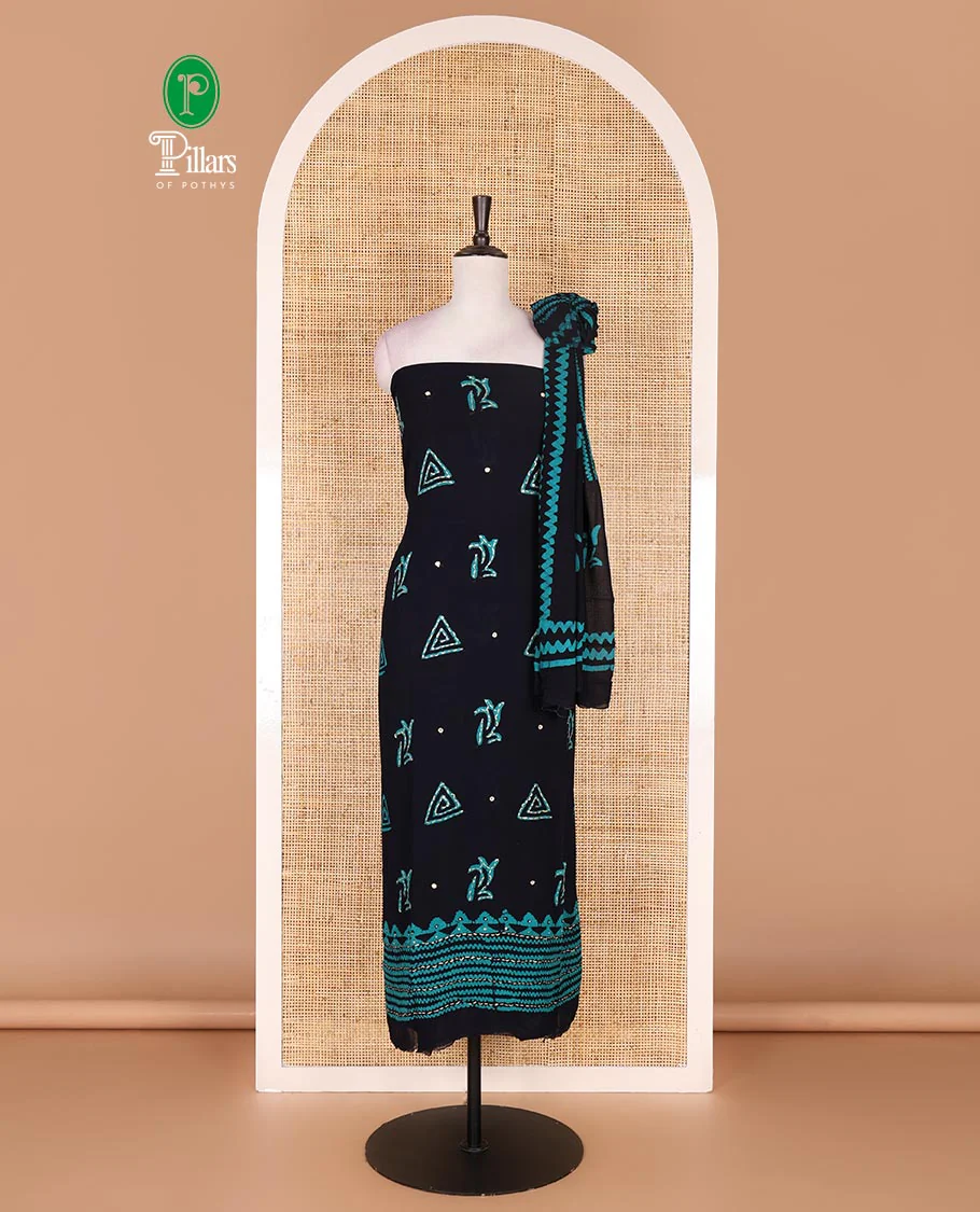 Navy blue and Rama green material chudidar set, batik print with kantha embroidered top, plain contrast bottom, and batik printed dupatta