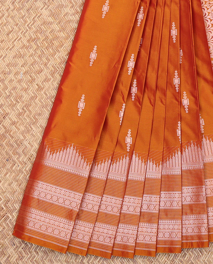 Orange Budget Silk Saree, Delicately Woven with Zari Buttas All Over Its Body, Highlighted by a Traditional Zari Design Border, Intricately Designed Pallu, and Paired with a Matching Blouse