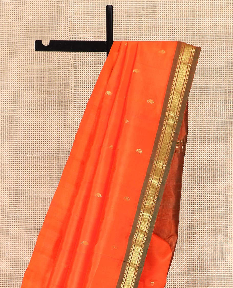 Orange Kanchipuram Silk Saree Mesmerized with Zari Buttas All Over Its Body, Complemented by a Contrast One-Sided Border of Rekku, Banaras, and Mayil Kann Designs, Pallu of Zari Stripes, and Comes Without a Blouse - Image 3