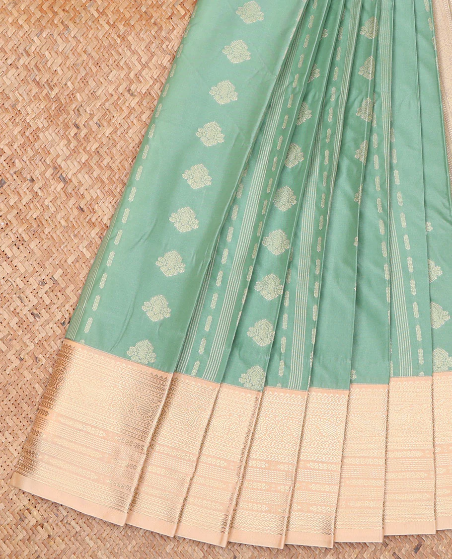 Pale Green Budget Silk Saree, Delicately Woven with Zari Buttas on Its Body, Complemented by a Contrast Traditional Zari Design Border, Geometric-Patterned Pallu, and Paired with a Contrast Blouse
