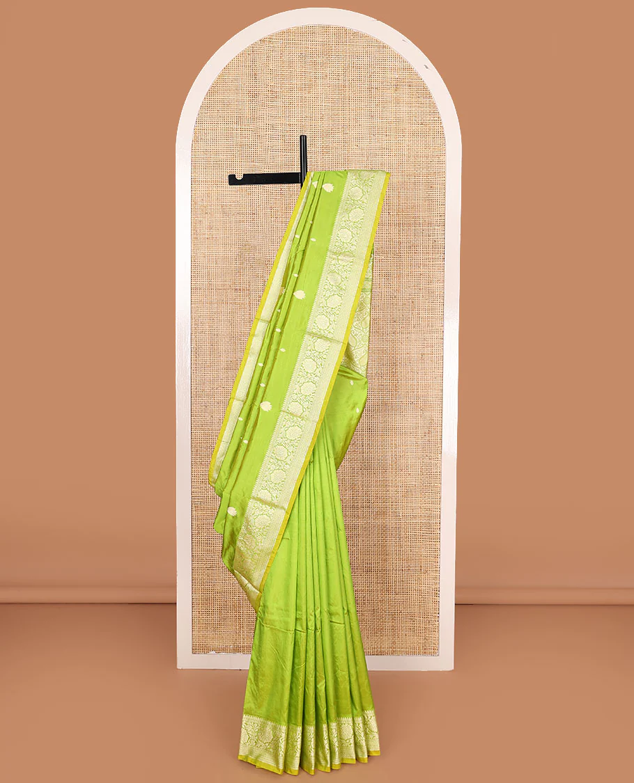 Parrot green buttas banarasi kathan silk saree, floral creeper border, and pallu of paisley jaal design
