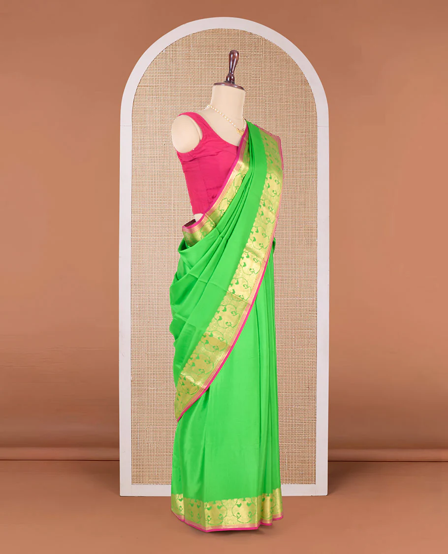 Parrot green plain Mysore silk saree, two-headed eagle zari border, and pallu steeped with two-headed eagle motifs