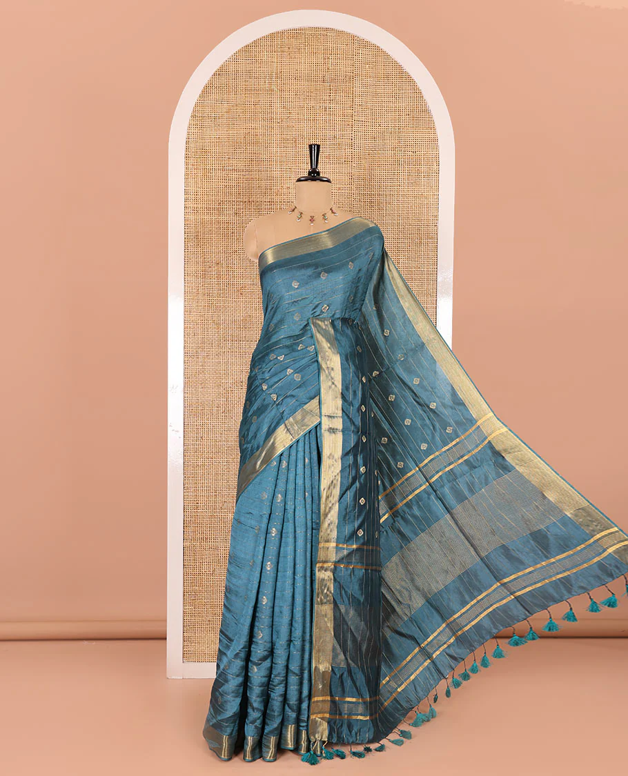 Peacock color zari buttas and striped banana pith saree, bavanji border, zari striped pallu, and a matching blouse