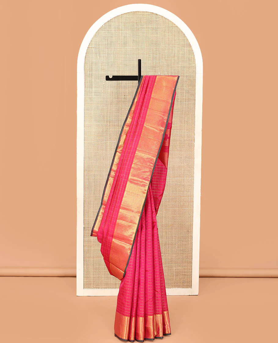 Pink zari checked Kanchipuram silk saree, zari border of rekku, banaras, and kamalam designs, and thazampoo rekku design pallu