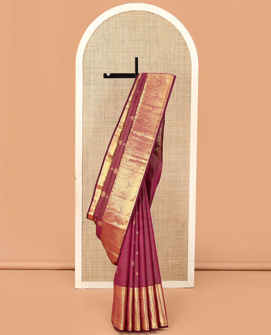 Purple zari stripes and buttas Kanchipuram silk saree,  zari border of thilakam, poun, and MUghal-style floral designs, and pallu steeped with manga motifs