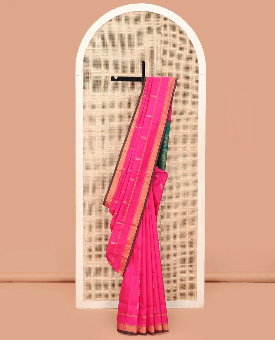 Rani Pink Uppada Silk Saree Elegantly Highlighted with Zari Buttas, Subtle Zari Border, Complemented by a Pallu of Peacock and Paisley Designs, and Paired with a Contrast Blouse
