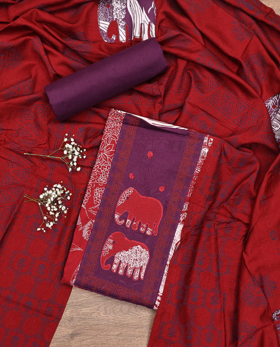 Red Material Chudidar Set, Adorned with Tropical Floral and Building Print and Neck Embroidery on Cotton Top, a Contrast Plain Cotton Bottom, and Paired with a Geometric Printed Matching Cotton Dupatta