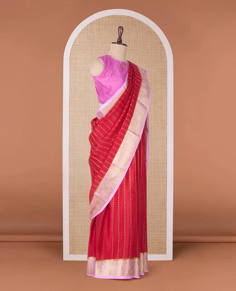 Red zari buttas Mysore silk saree, contrast peacock chakra motifs border, and traditional zari design pallu