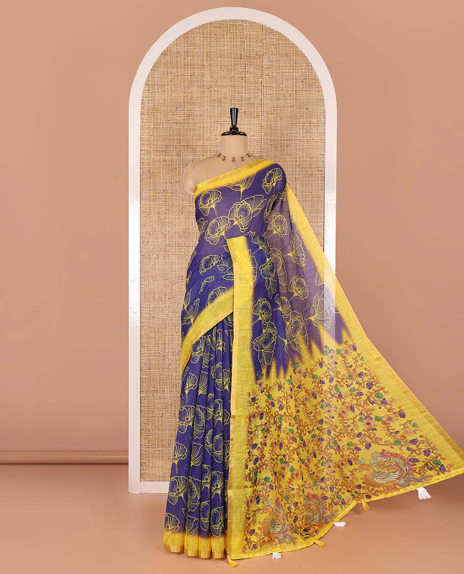 Royal blue floral printed linen cotton saree, contrast piping border, kalamkari floral and peacock printed pallu, and a contrast floral vine printed blouse
