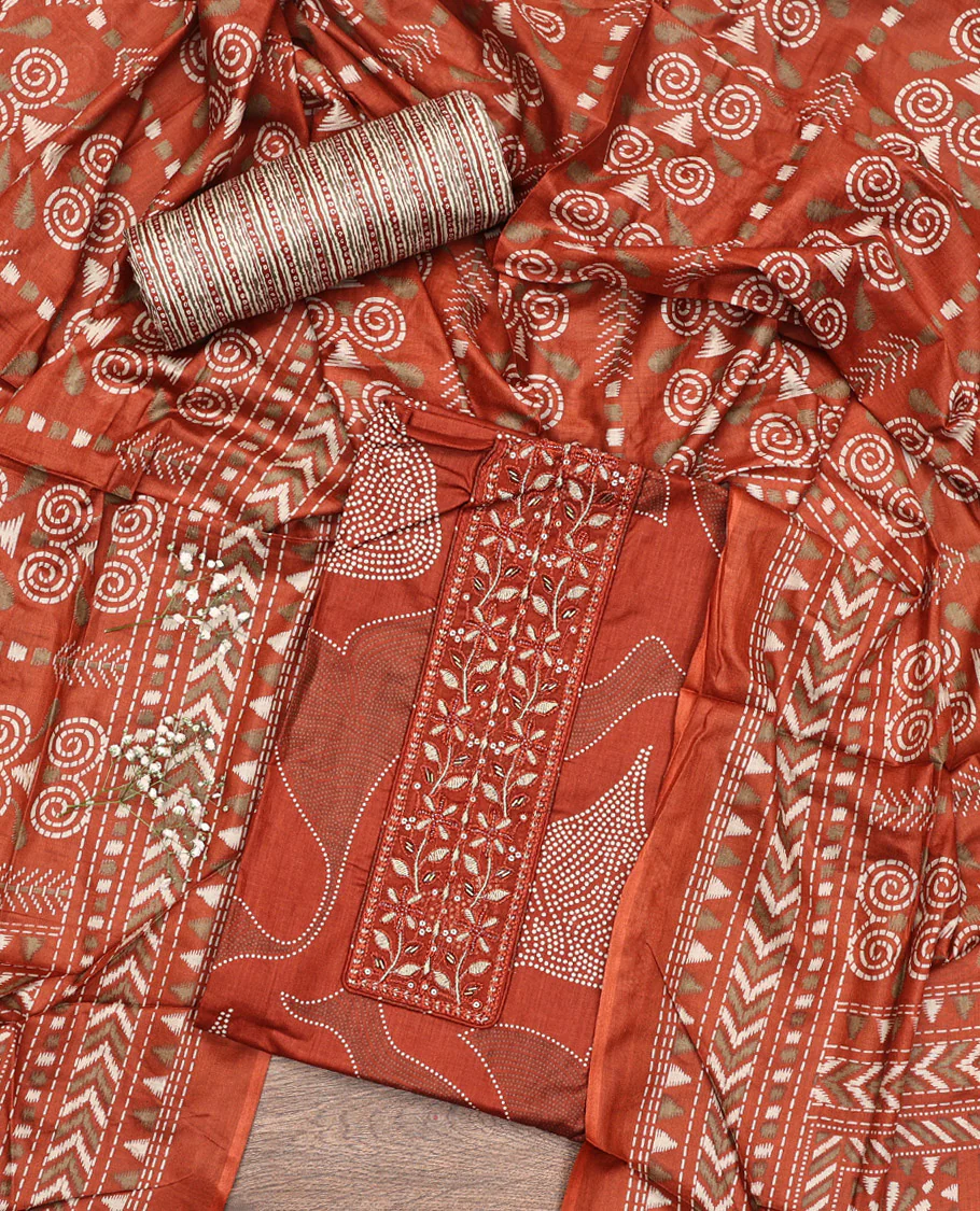 Rust Material Chudidar Set, Decorated with Abstract Print and Neck Embroidered Cotton Top, a Printed Cotton Bottom, and Paired with a Ikkat-Style Geometric Printed Cotton Dupatta