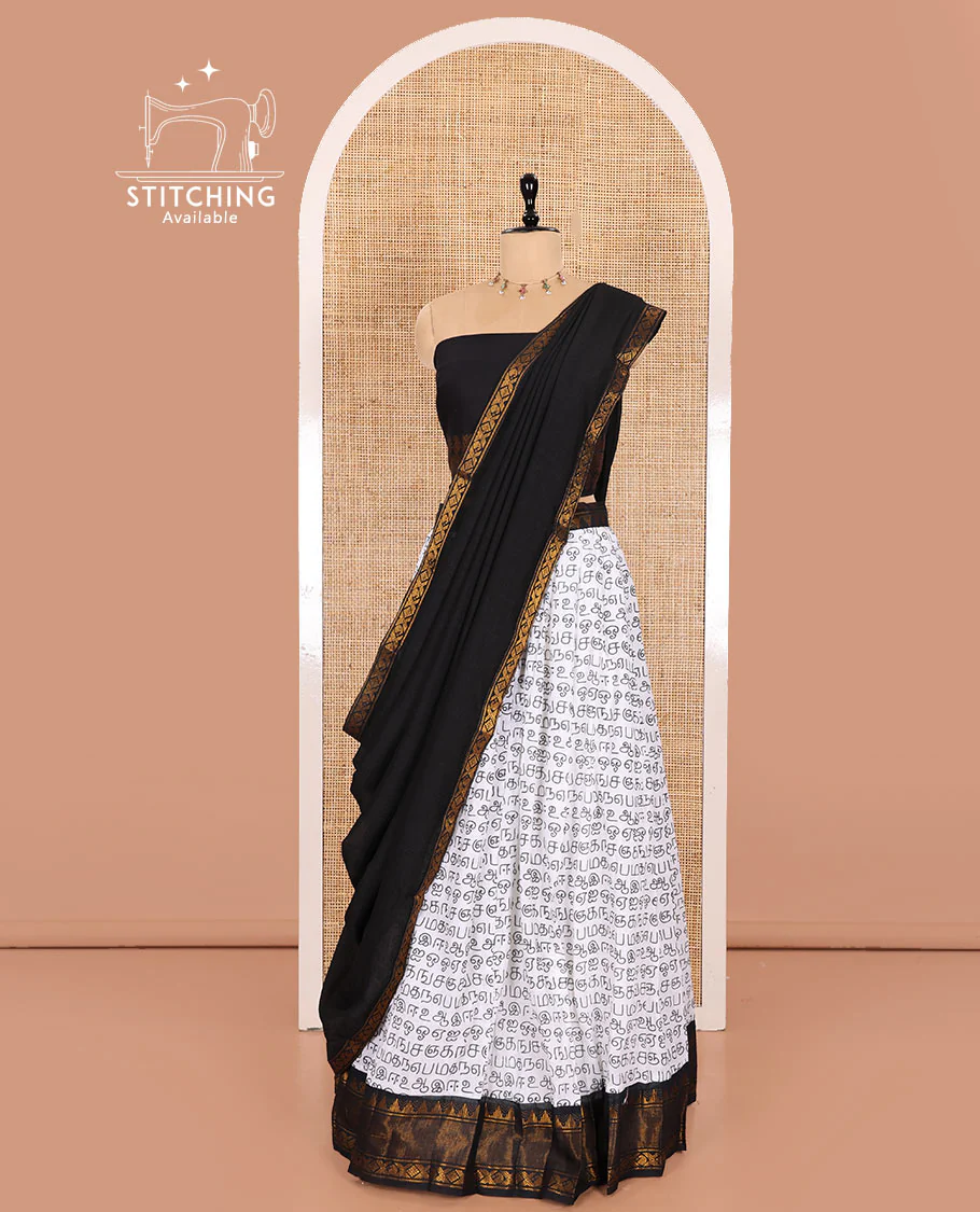 White and Black Printed Sungudi Cotton Half-Saree Showcasing a Skirt Printed with Tamil Letters, Accentuated by a Contrast Traditional Zari Border, a Contrast Blouse, and a Plain Zari-Bordered Dhavani - Image 3