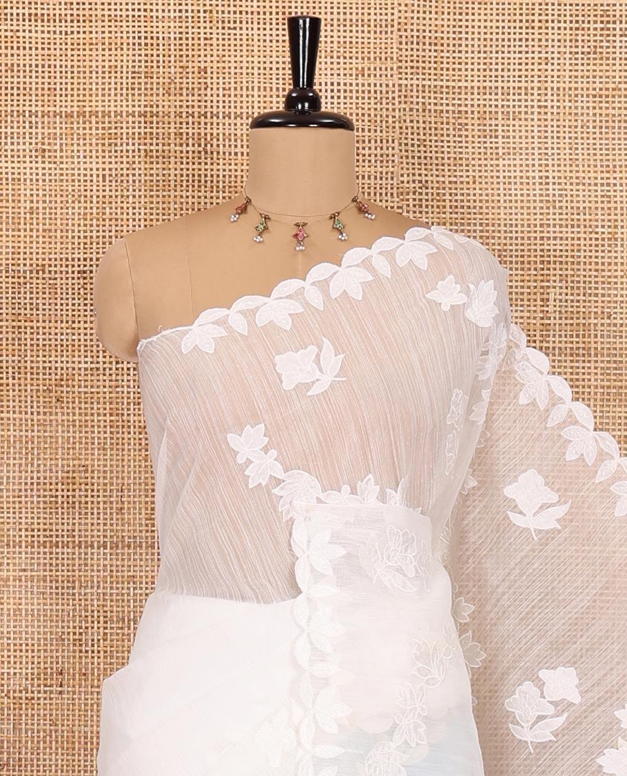 White floral motifs and diagonal floral creeper applique embroidered linen saree, scallop border, floral embroidered pallu, and a plain blouse - Image 2