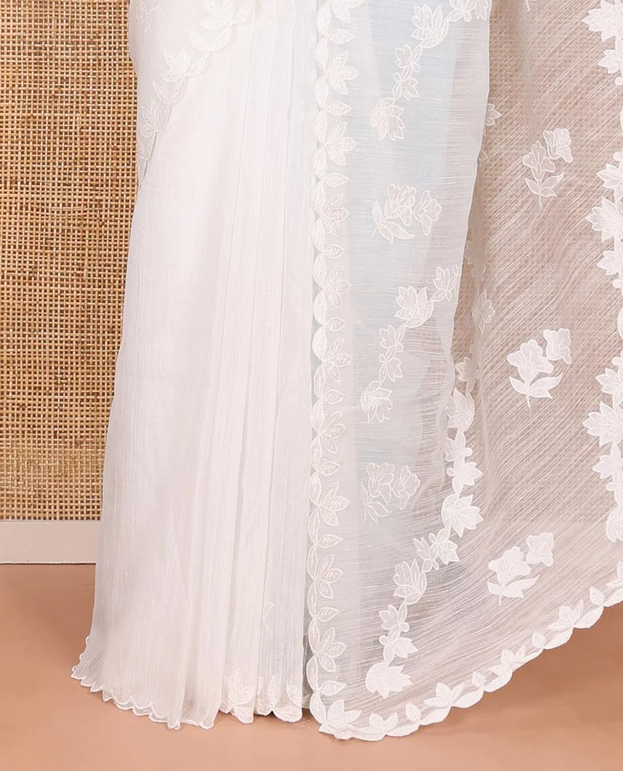 White floral motifs and diagonal floral creeper applique embroidered linen saree, scallop border, floral embroidered pallu, and a plain blouse - Image 3